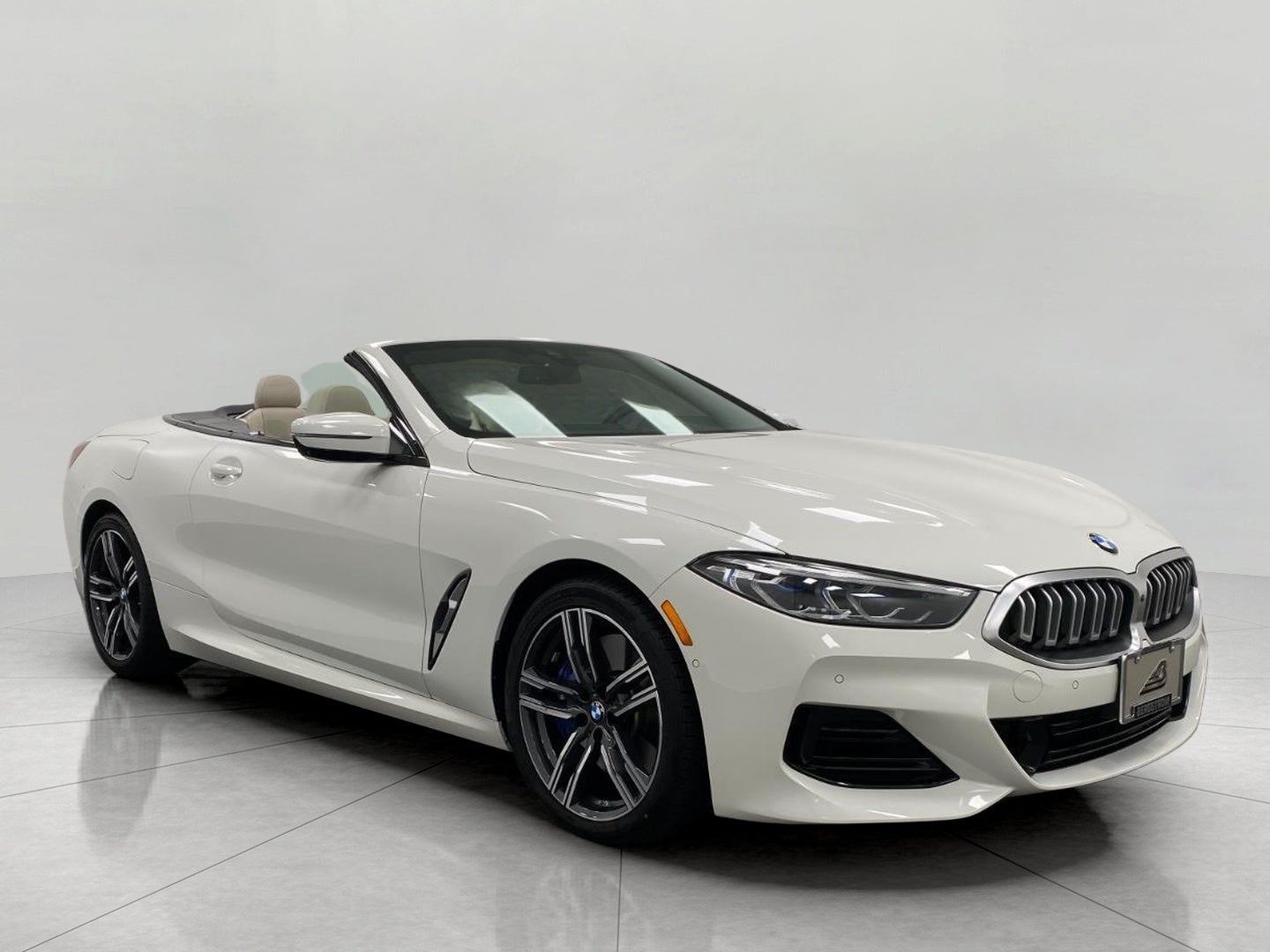 2024 BMW 8 Series 840i xDrive Convertible in Alpine White — front three-quarter view